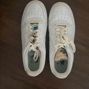 Nike White Sneakers with Blue and Silver Accents